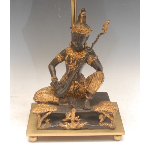 3484 - Thai School, a bronze, of a Buddha playing a veena, later converted to a lamp and mounted on a brass... 