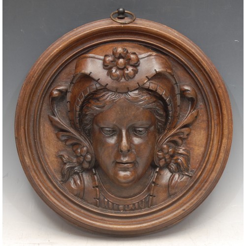 3697 - Treen - a 19th/early 20th century French provincial mahogany circular wall plaque, depicting a young... 