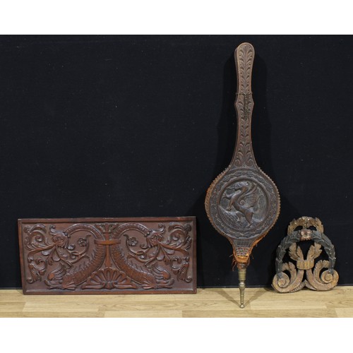 4052 - Treen - a 19th century French oak set of bellows, the central roundel carved in relief with a dragon... 