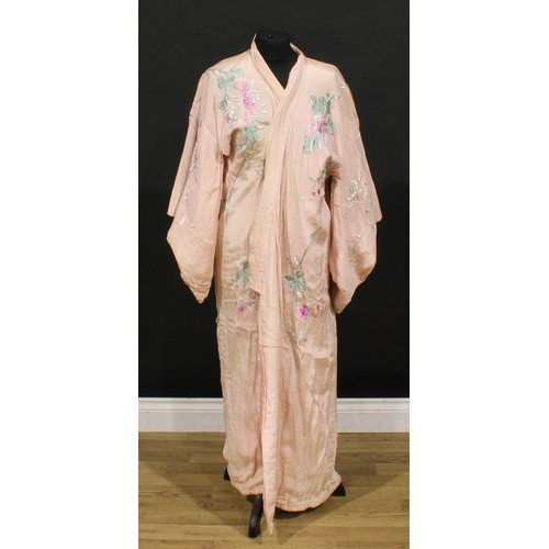 3689 - A 1920s pink silk kimono, richly embroidered in raised silk threads with bold flowerheads and birds ... 