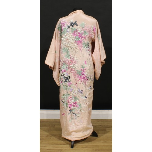 3689 - A 1920s pink silk kimono, richly embroidered in raised silk threads with bold flowerheads and birds ... 