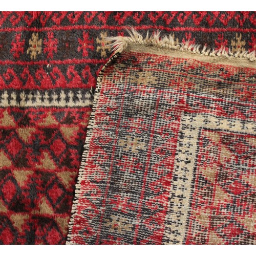 3678 - Rugs & Carpets - a mid 20th century Afghan wool rug, in the Balouch style, 157cm long, 190cm wide