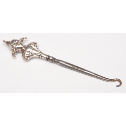 3685 - An Edwardian novelty glove hook, the terminal as Mr Punch, Birmingham 1907; others similar, Jester, ... 