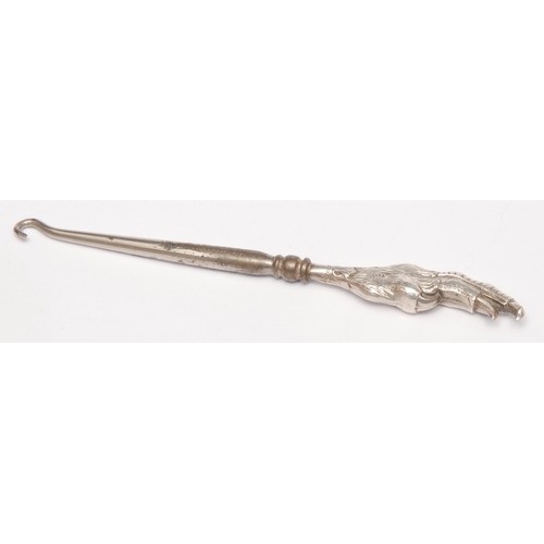 3685 - An Edwardian novelty glove hook, the terminal as Mr Punch, Birmingham 1907; others similar, Jester, ... 