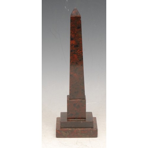 3551 - A 19th century Cornish red serpentine desk model, of an obelisk in the Grand Tour taste, stepped squ... 