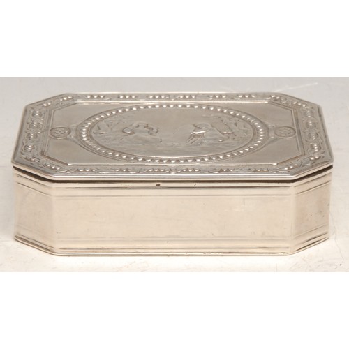 3681 - A Continental silver canted rectangular table snuff box, hinged cover, chased in the neoclassical ta... 