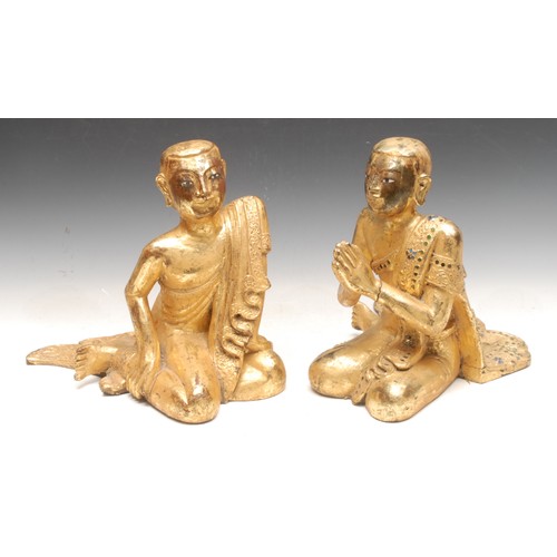 3141 - A pair of 19th century Mandalay giltwood monk statues or Buddhas, one kneels in the Namaste position... 