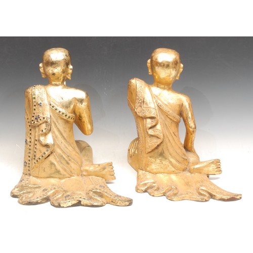 3141 - A pair of 19th century Mandalay giltwood monk statues or Buddhas, one kneels in the Namaste position... 