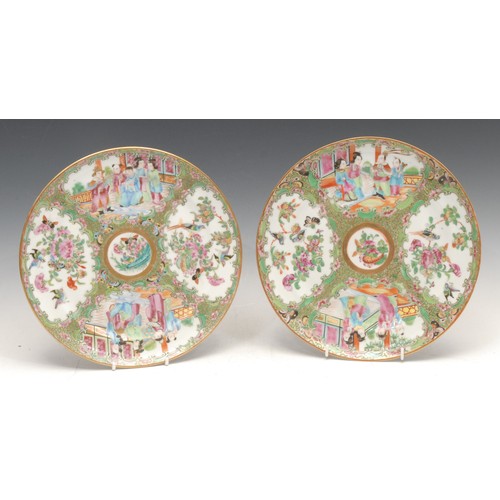 3142A - A pair of Chinese circular plates, decorated in the famille rose palette, in the Cantonese taste, 24... 