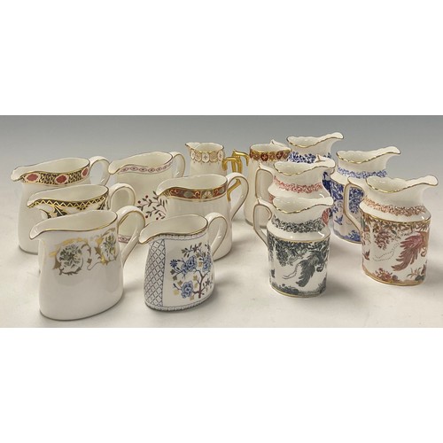 38 - A collection of Royal Crown Derby cream jugs, various shapes, including Mikado, Blue Aves, Red Aves,... 