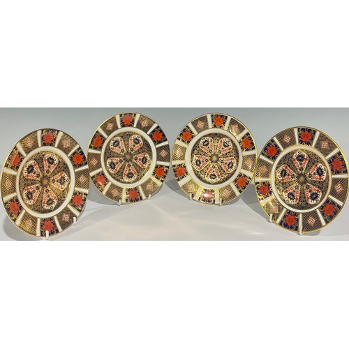 42 - A pair of Royal Crown Derby Imari palette 1128 pattern tea plates, first quality; two others, second... 