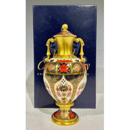 61 - A Royal Crown Derby Imari palette 1128 pattern pedestal two handled vase and cover, solid gold band,... 