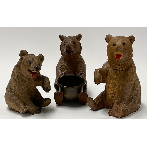 65 - A Black Forest novelty pin dish, carved as a bear holding a brass bowl; others (3)