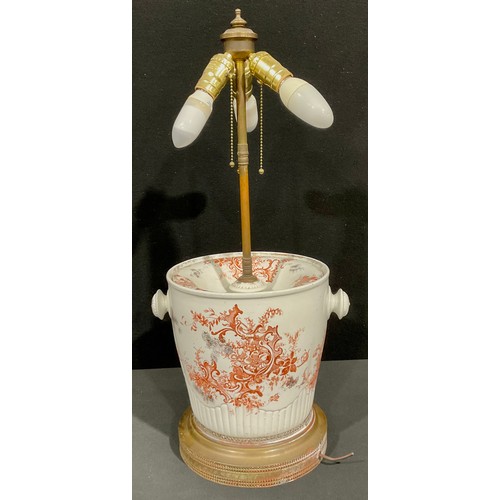 69 - Interior Decoration - an unusual brass mounted porcelain table lamp, modelled from a 19th century sl... 