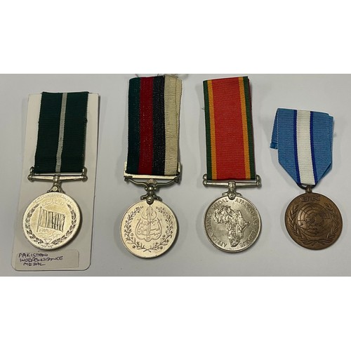 193 - Medals - A South Africa Service medal; a UN medal; Pakistan Independance; another