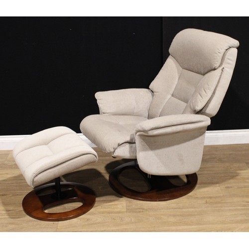 123 - A Global Furniture Alliance swivel lounge chair, 104cm high, 75cm wide, the seat 43cm wide and 49cm ... 