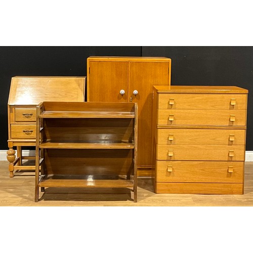 124 - A retro design Stag chest of five long drawers; an oak press cupboard; bureau; bookcase (4)