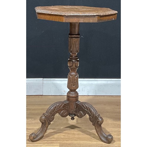 381 - A late Victorian Arts & Crafts period carved oak tripod wine table, 68.5cm high, 40cm wide