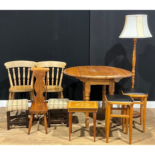 384 - A farmhouse pine dropleaf table; a pair of Victorian style beech side chairs; an oak spinning chair;... 