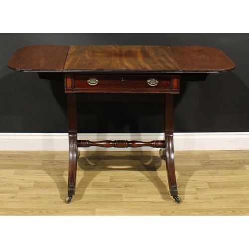 386 - A 19th century mahogany sofa table, rounded rectangular top with fall leaves above a frieze drawer, ... 