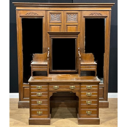 404 - A late Victorian/Edwardian oak two-piece bedroom suite, comprising compactum wardrobe and dressing t... 