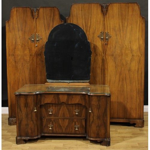 406 - An Art Deco style walnut veneer bedroom suite, comprising wardrobes and dressing table, the wardrobe... 