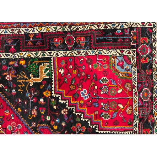 591 - Middle East and the Orient - an Iranian Hamadan wool rug or carpet, 232cm x 137cm