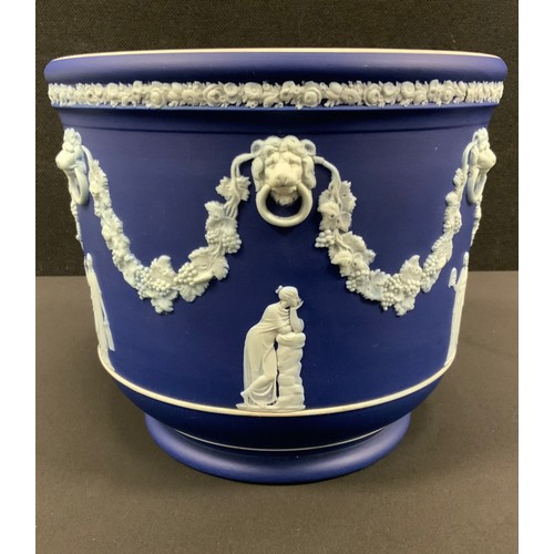 14 - A Wedgwood Blue Jasper jardinière, typically sprigged with classical figures after the antique, belo... 