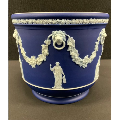 14 - A Wedgwood Blue Jasper jardinière, typically sprigged with classical figures after the antique, belo... 