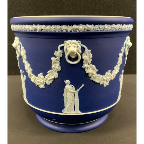 14 - A Wedgwood Blue Jasper jardinière, typically sprigged with classical figures after the antique, belo... 