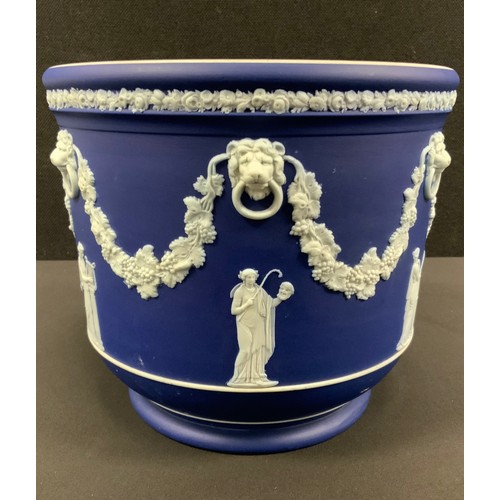 14 - A Wedgwood Blue Jasper jardinière, typically sprigged with classical figures after the antique, belo... 