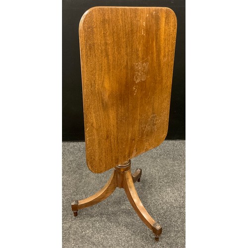 26 - A 19th century mahogany tilt top tripod table, the rounded rectangular top on turned urnular-shaped ... 