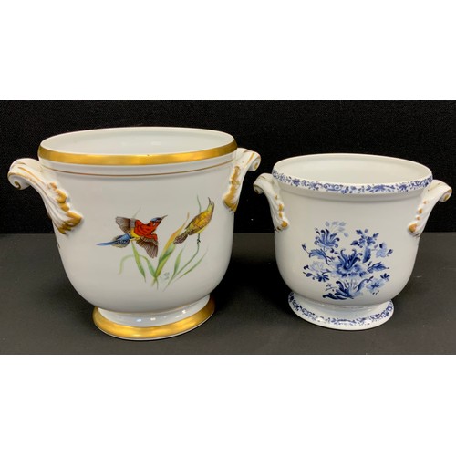 62 - A continental porcelain two-handled wine cooler or cachepot, 18cm high; another (2)