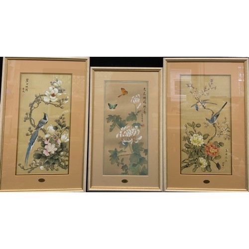 63 - A pair of 20th century hand painted oriental silk panels, decorated with butterflies, birds and flow... 