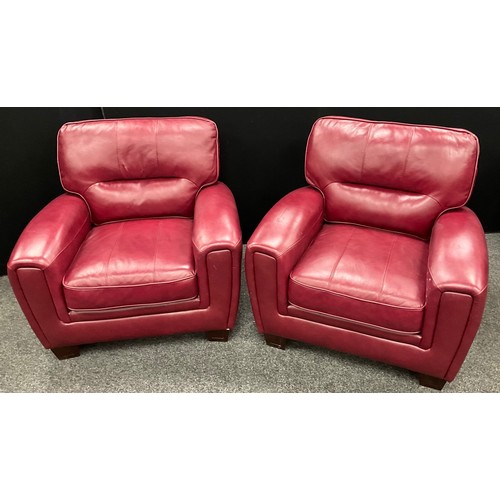 255 - An ‘Italia Lucca’ type model red leather three seat sofa, and matching pair of armchairs - the sofa ... 