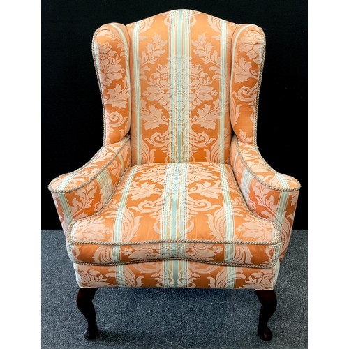 259 - A George III style wingback armchair, ‘The Wellington’ model, by Earlham, of High Wycombe, 106cm hig... 