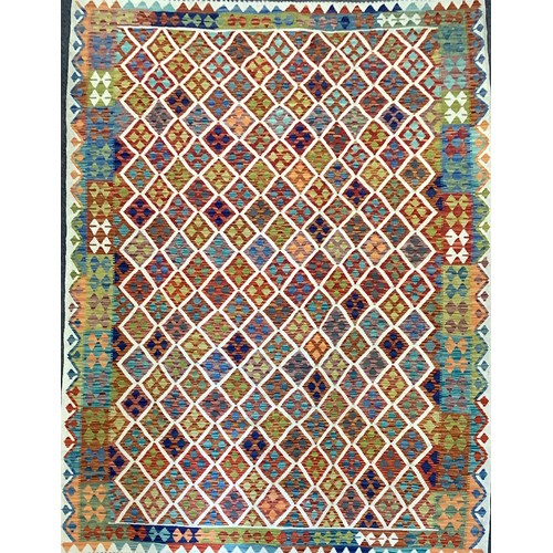 260 - An Anatolian Turkish Kilim rug, hand-knotted with a geometric patterned field, in many colours,  300... 