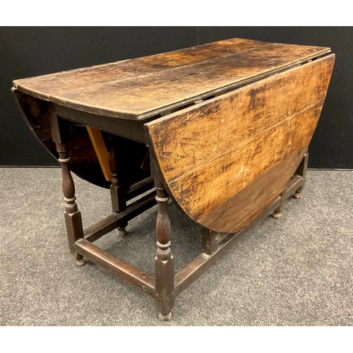 270 - An early 18th century oak oval gateleg dining table, to seat eight, drawer to frieze, turned legs, 7... 