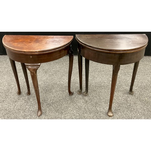 279 - A near pair of 18th century mahogany demi-lune tea tables, possibly Irish, and of small proportions,... 