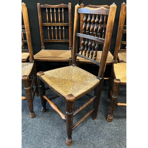 286 - A set of seven George III oak and elm rush-seated chairs, spindle backs, turned supports, 99.5cm hig... 