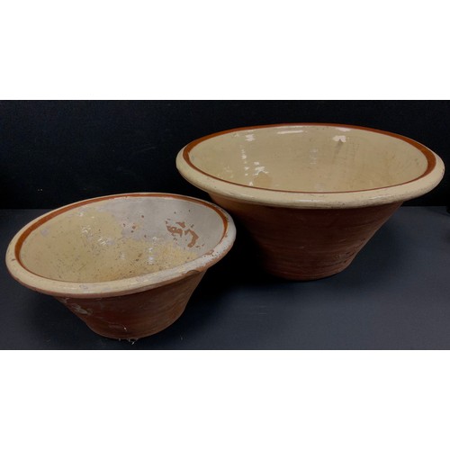 310 - A large terracotta pancheon bowl, 50cm dia, conforming smaller (2)