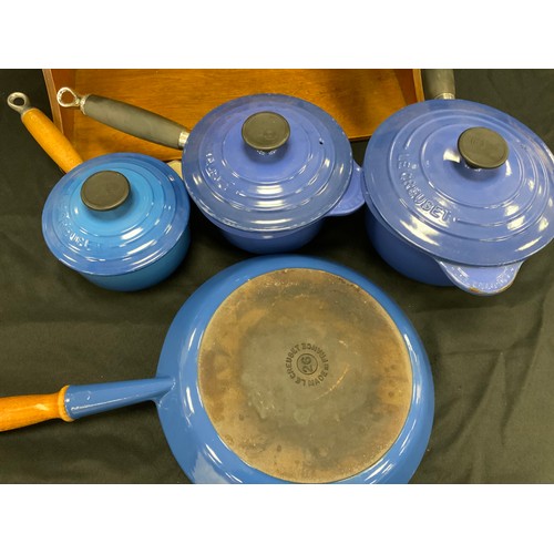 228 - Le Creuset - a set of five Le Creuset cast iron blue pans, azure pattern including; three lidded pan... 