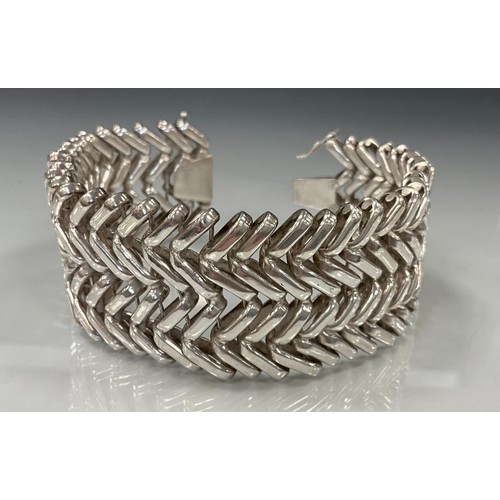 440 - A fancy double V link Philippines silver metal bracelet, unmarked, 3.7cm wide, 22.3cm long, 145.9g g... 