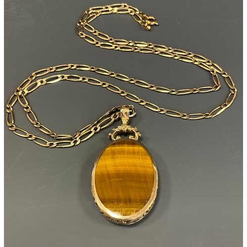 458 - A tigers eye and black onyx reversible pendant necklace, 9ct gold mount and fancy link chain, 58cm l... 