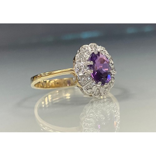 472 - A diamond and amethyst cluster ring, central oval amethyst approx 1.45ct, above six round brilliant ... 