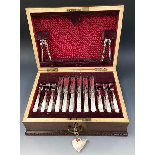 309 - A Mappin and Webb mother of pearl handled canteen service for twelve, with original wooden case