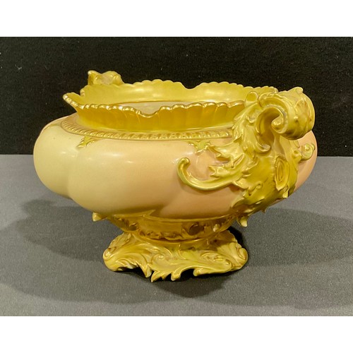 30 - A Royal Worcester rococo style bowl, scrolling acanthus leaf handles and pedestal base, in blush ivo... 