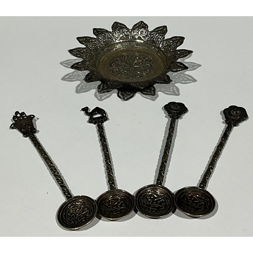 54 - Four Islamic spoons; an Islamic filigree cachou dish