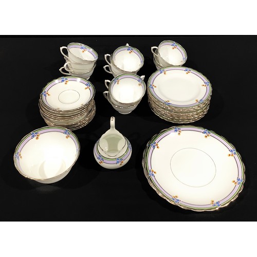 69 - An Art Deco Tuscan China tea service for twelve, comprising cake plates, side plates, cream jug, sug... 