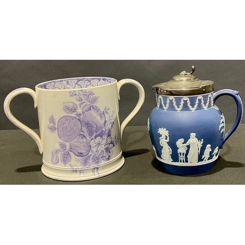 72 - A large Staffordshire two-handled loving mug, transfer printed in lilac with fruit and flowers, the ... 